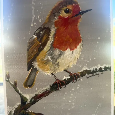Example painting for the class: a robin on a snowy branch, painted in acrylic.